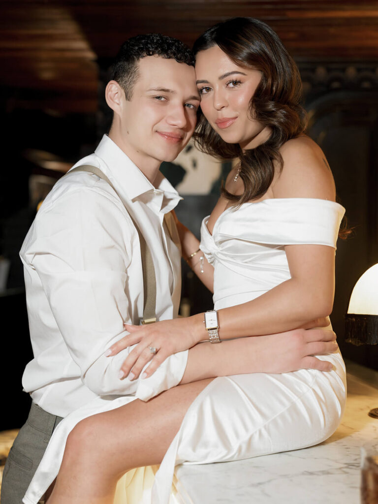 Classic portrait with couple on bar at Beacon Hill engagement session