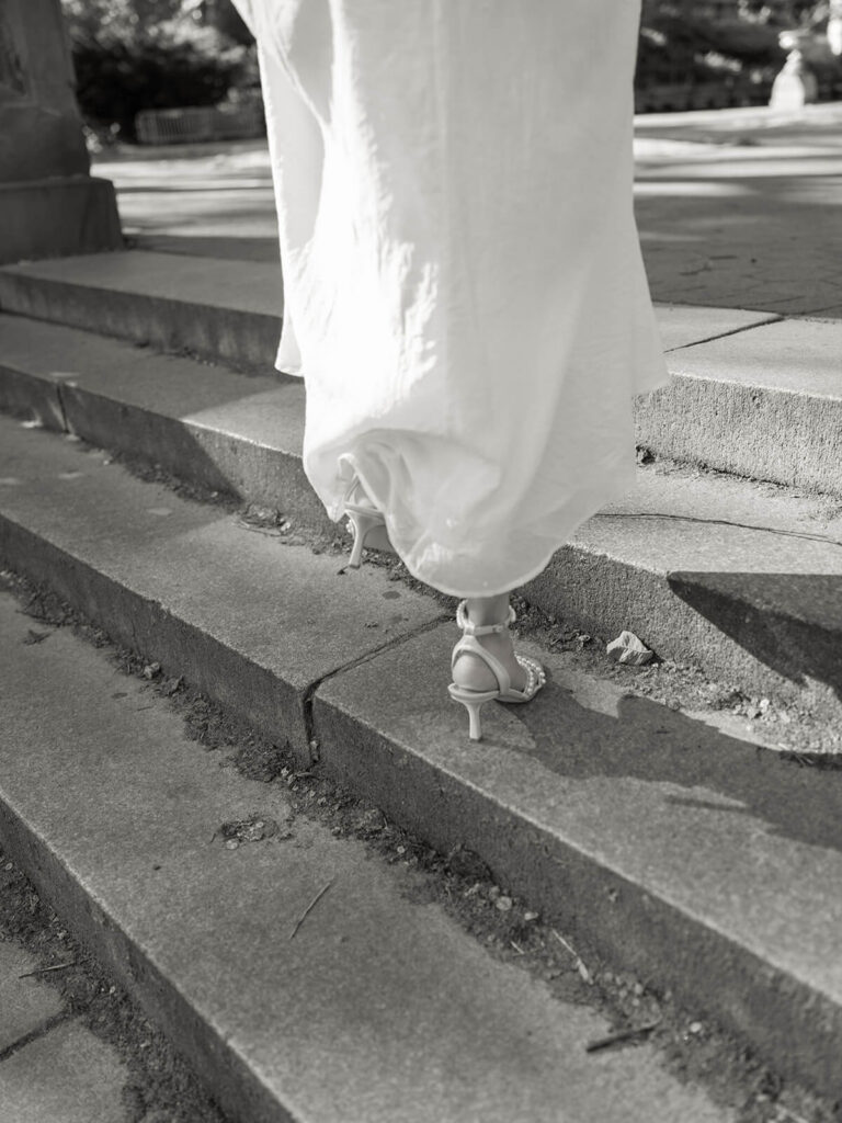 Central Park engagement session at Bethesda Terrace grand staircase with spring foliage