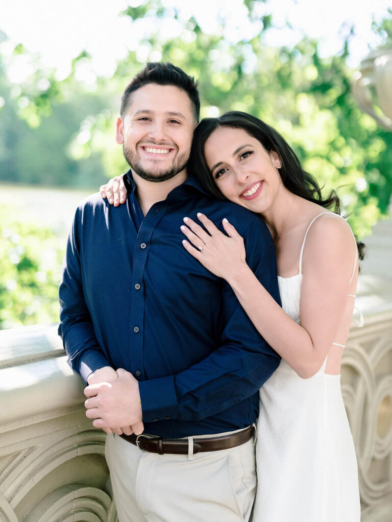 Intimate engagement moment beneath Bethesda Terrace arcade Minton tile ceiling