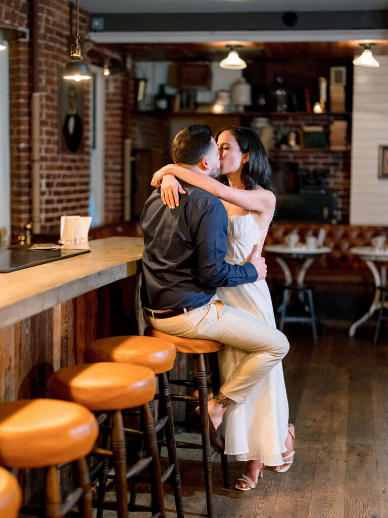 NYC engagement photos under Bethesda Terrace carved stone arches and balustrades