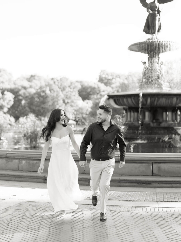 Central Park engagement photography at Bethesda Terrace with lush spring foliage