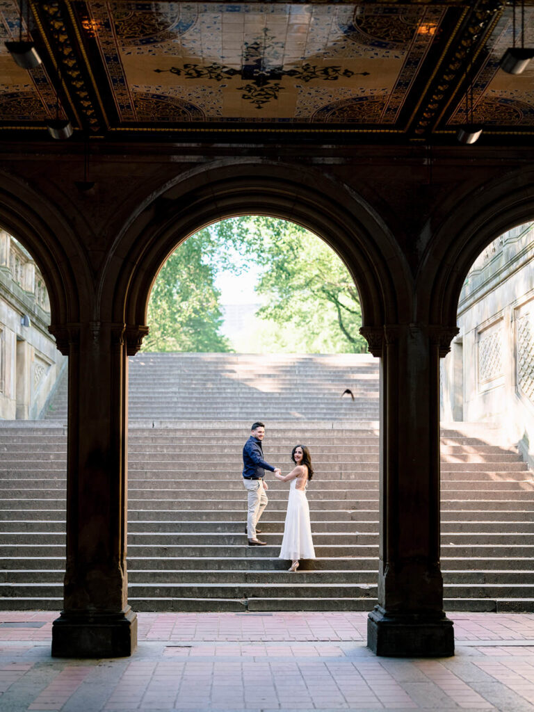 Bethesda Terrace arcade engagement photos with carved medallions and arches
