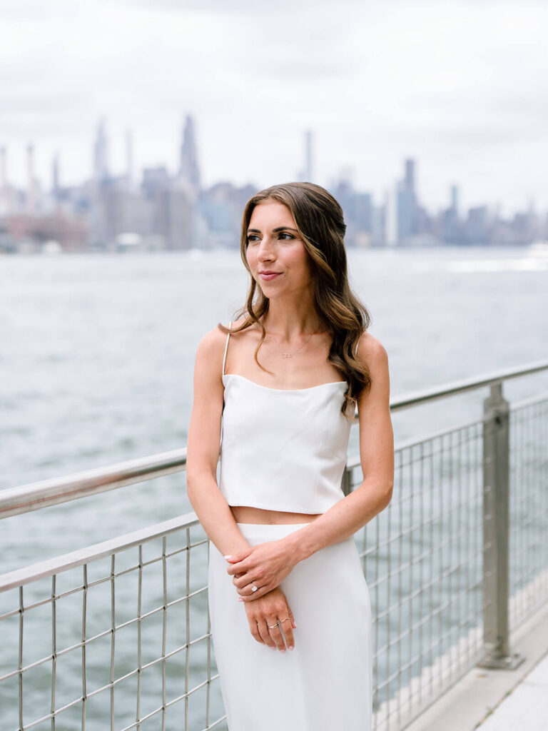 NYC engagement party portraits with Williamsburg Bridge and East River views