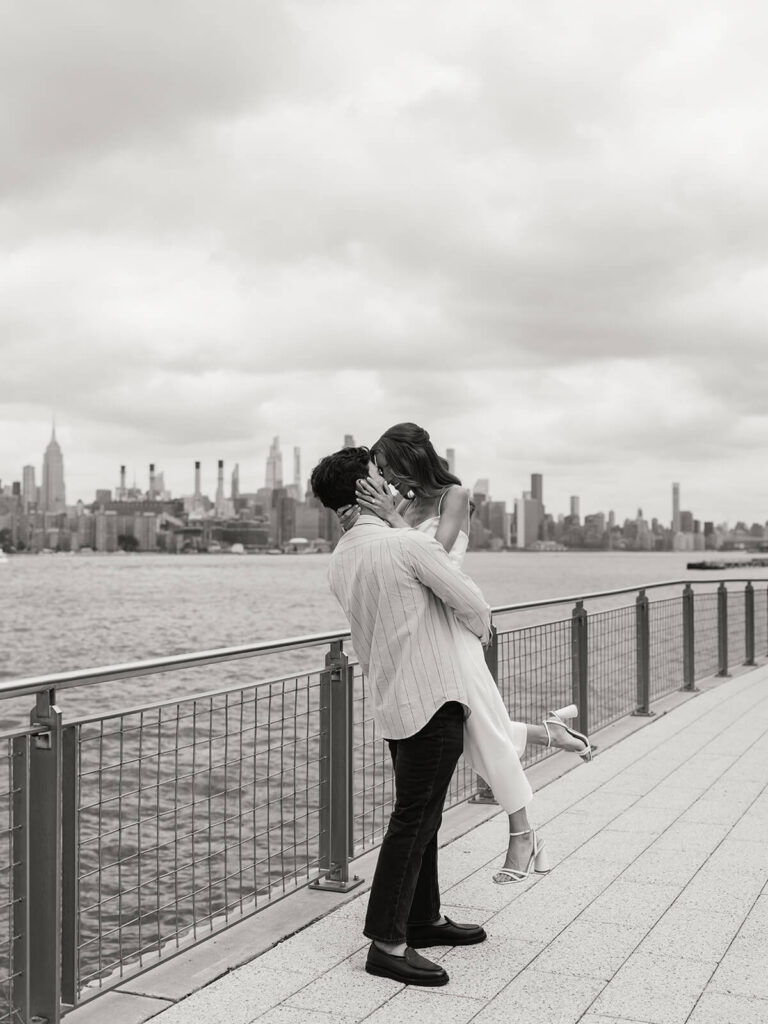 Brooklyn engagement photos at Domino Park featuring Williamsburg Bridge views