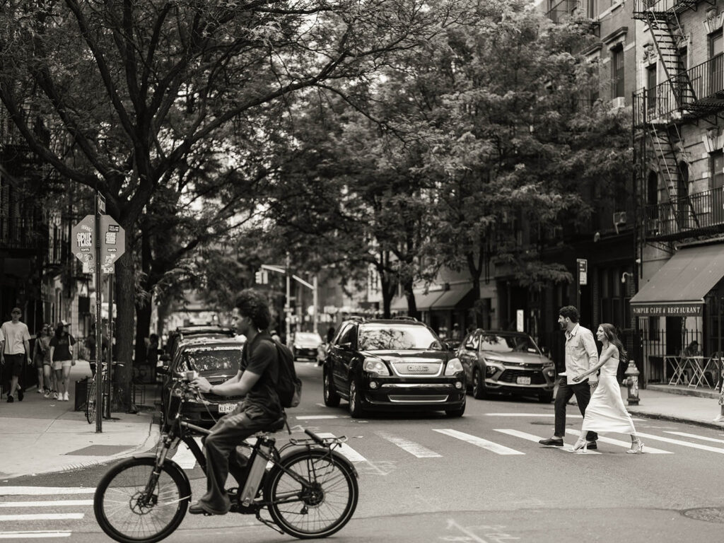 Candid couple walking together during Brooklyn waterfront engagement portraits