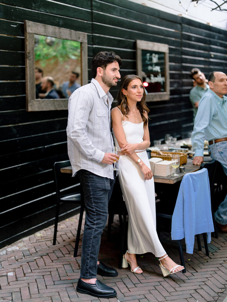 Brooklyn NYC engagement party photographer captures guests at Sauced venue celebration