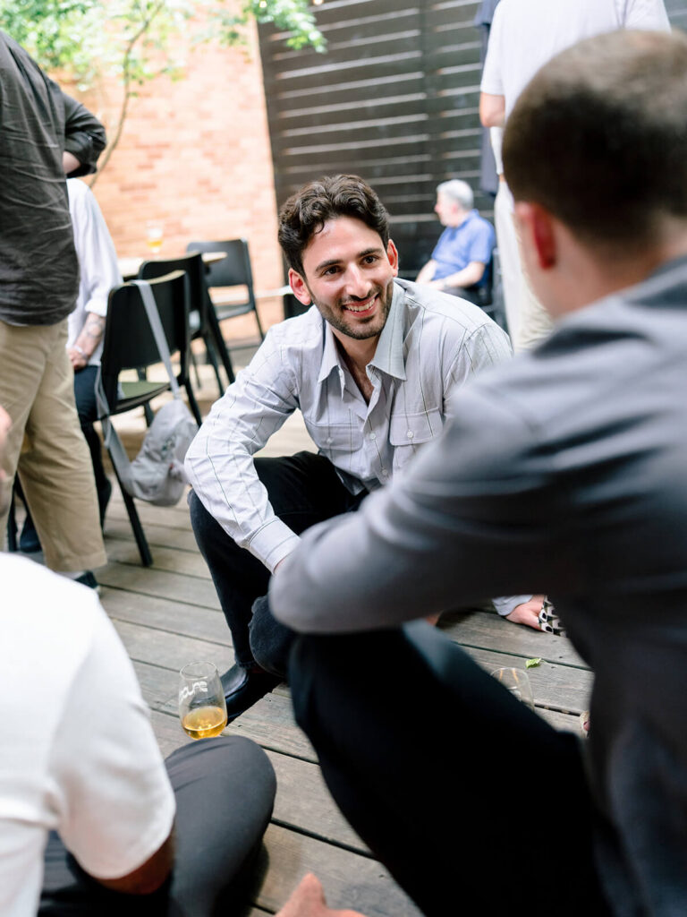 NYC engagement celebration photography at Brooklyn garden venue with friends
