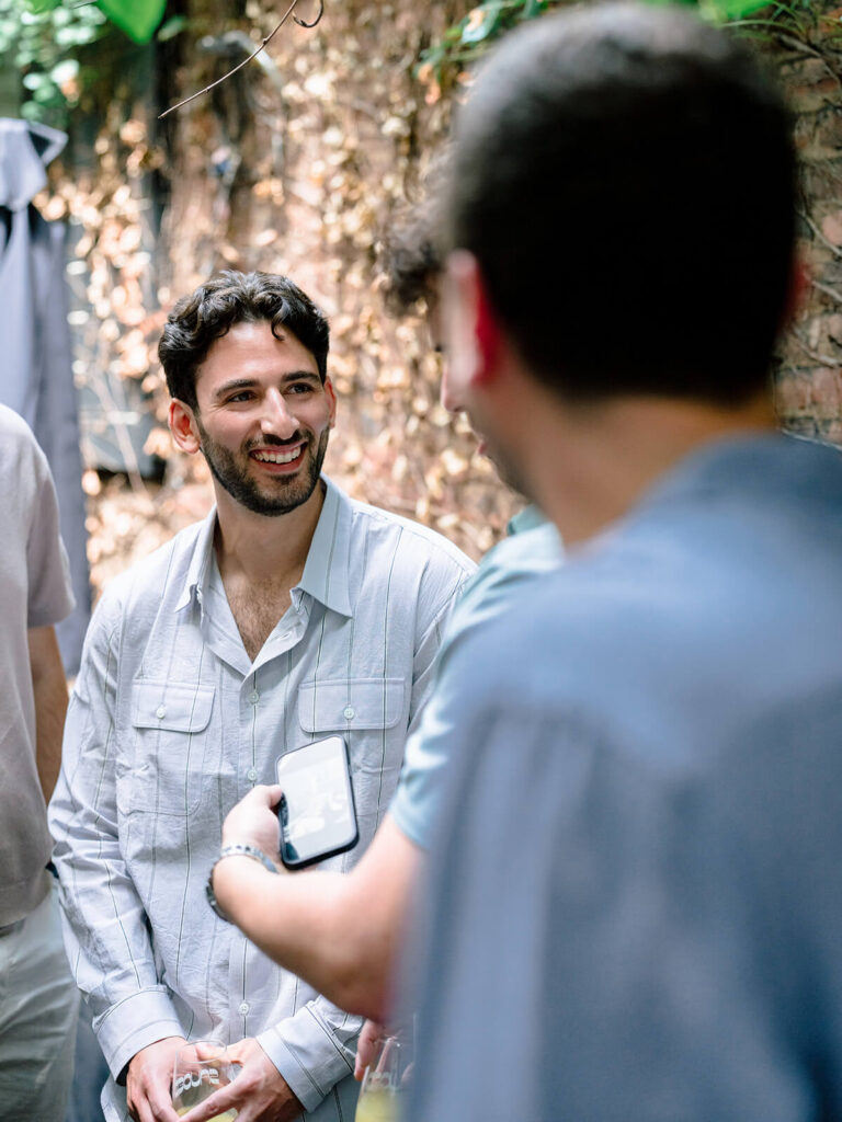 Joyful engagement party celebration photos at Sauced Brooklyn garden venue NYC