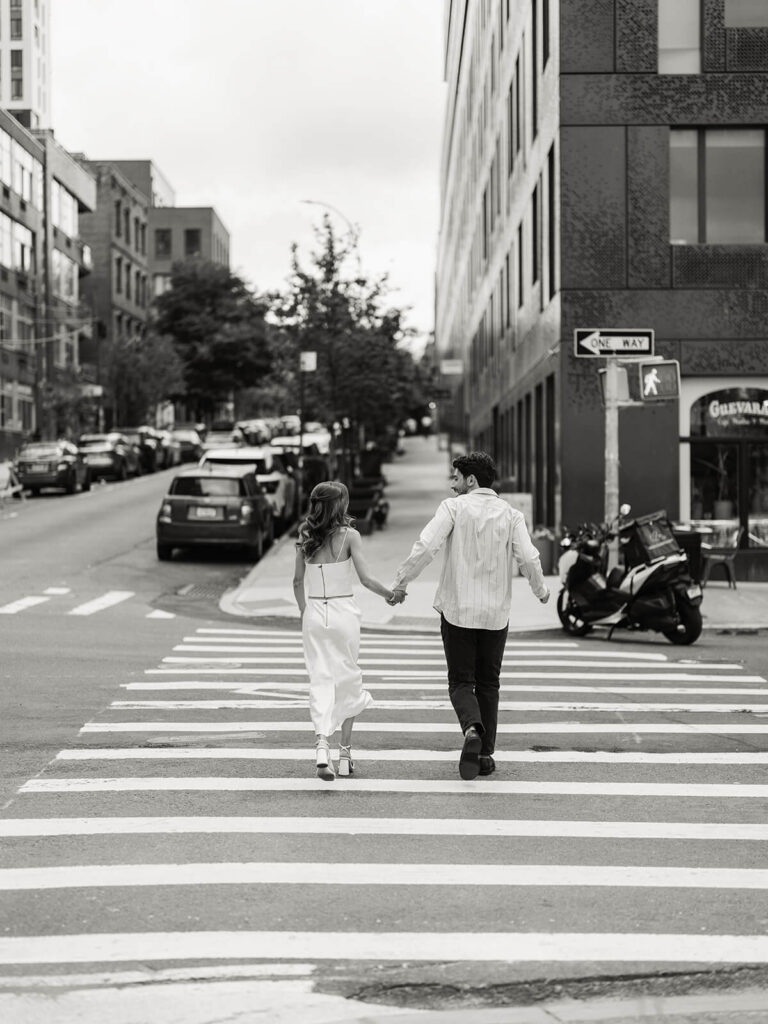 Black and white crosswalk moment during Brooklyn engagement party photography session