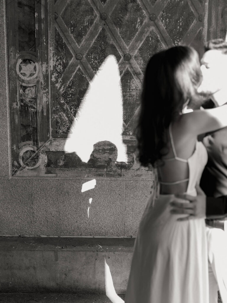 NYC engagement session at classic Upper East Side bar with exposed brick