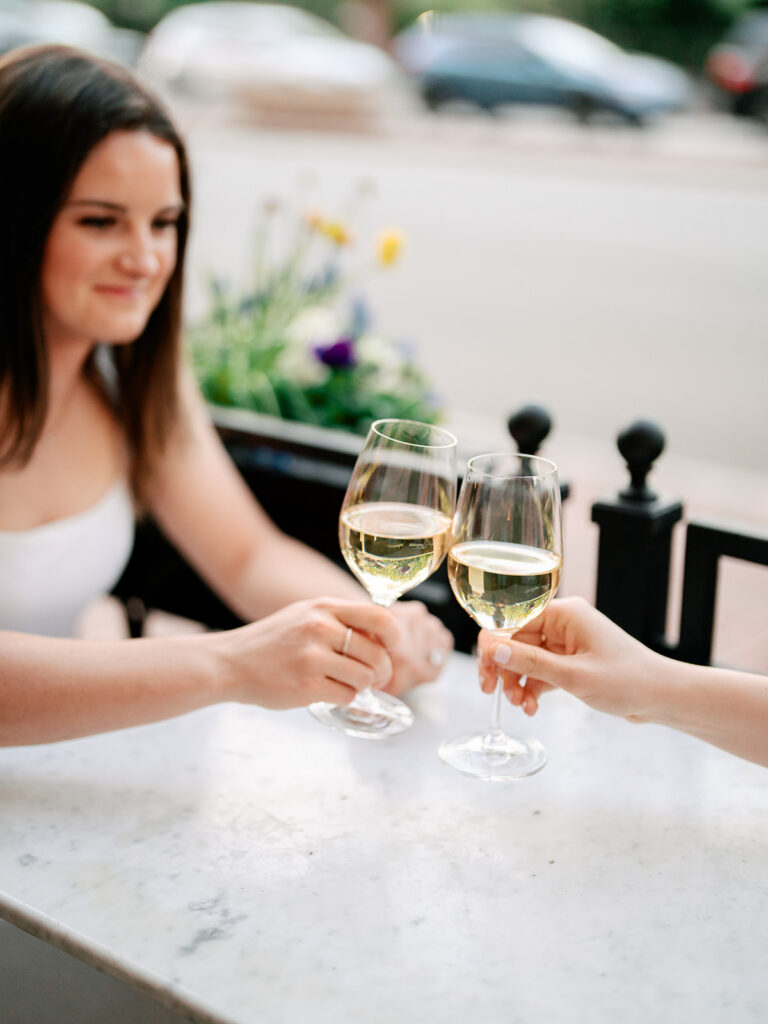 Romantic engagement moment beneath flowering trees Boston Public Garden spring