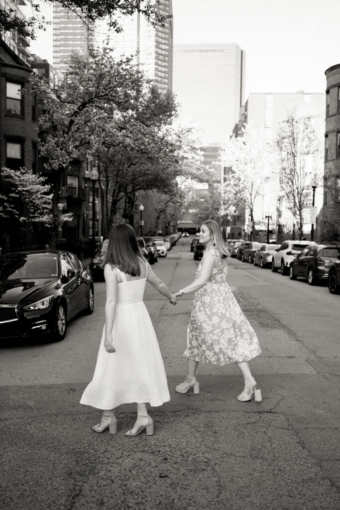 Spring engagement session at Boston Public Garden with lush green lawn backdrop