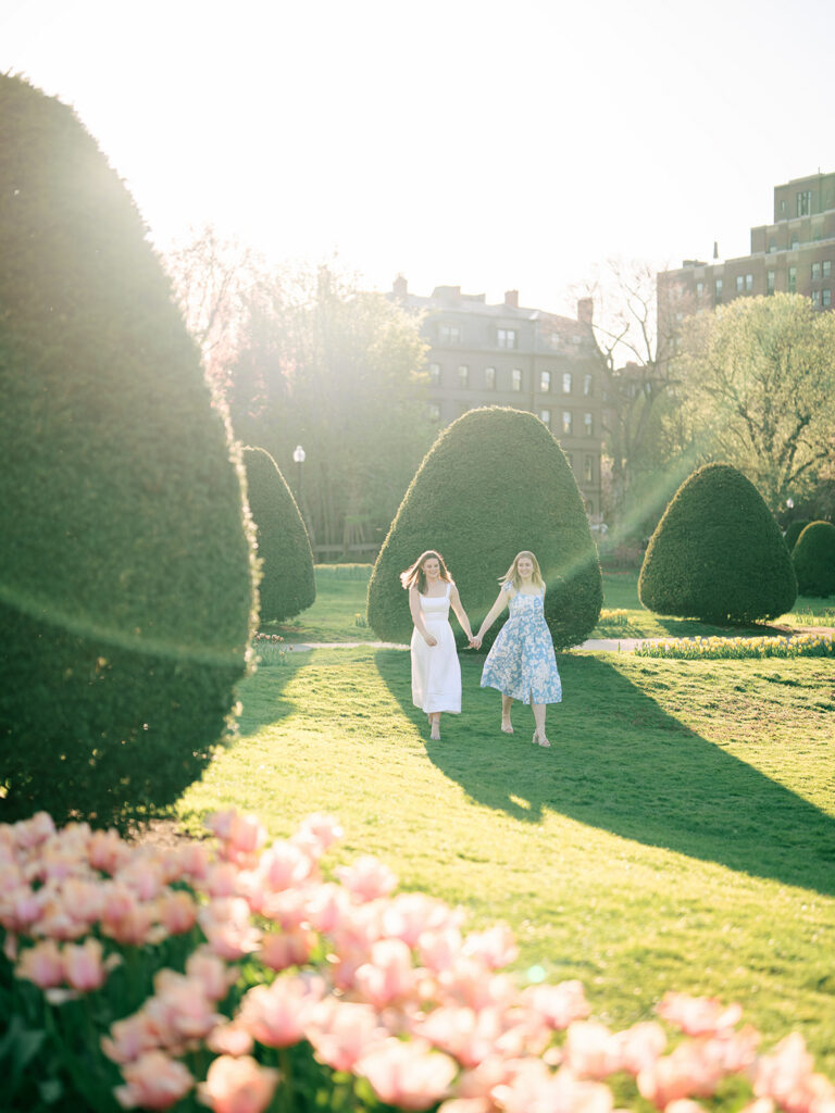 Spring engagement portraits in Boston Public Garden with blooming magnolia trees