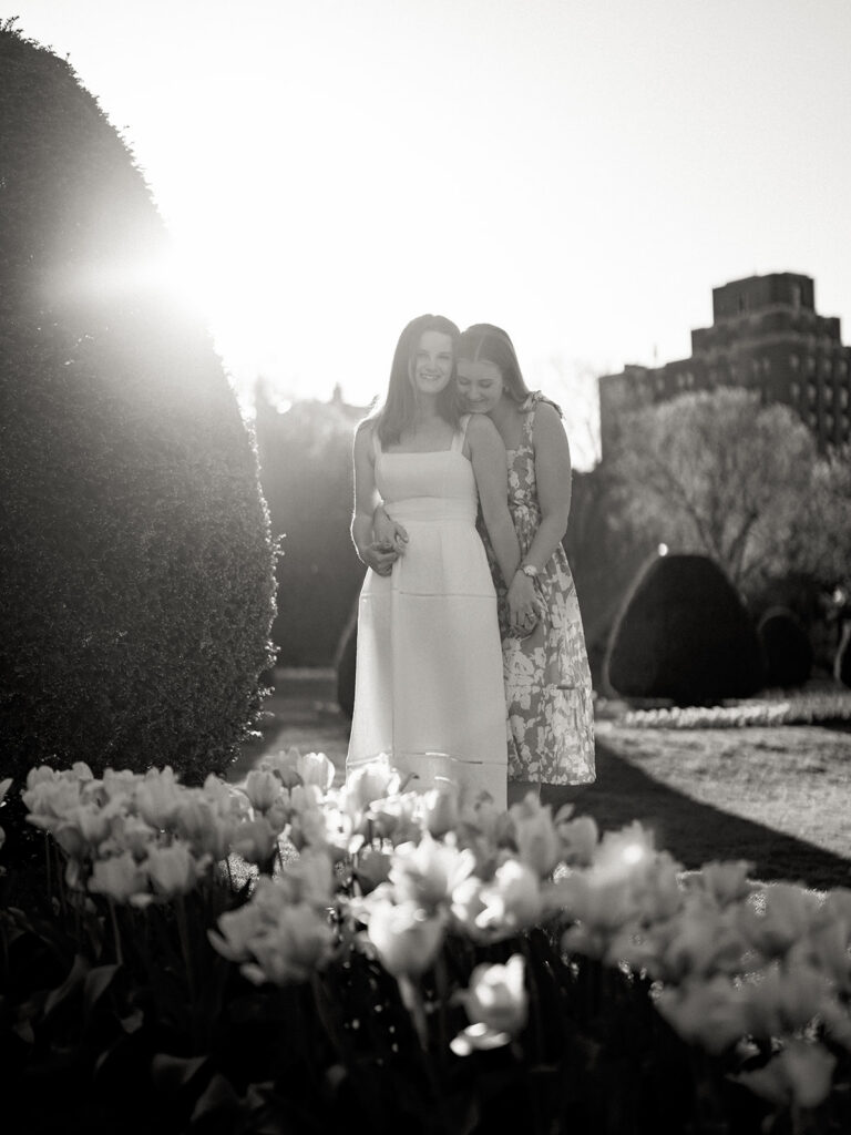 LGBTQ engagement session Boston featuring two brides in coordinated spring dresses
