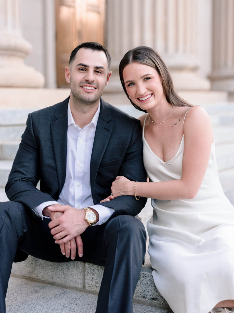 Close-up portrait of couple seated on stone steps at Gandhi Park Charlotte engagement session