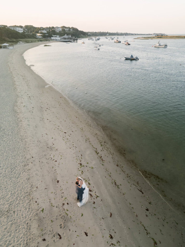 Bride and groom portrait by the water at Chatham Bars Inn on Cape Cod