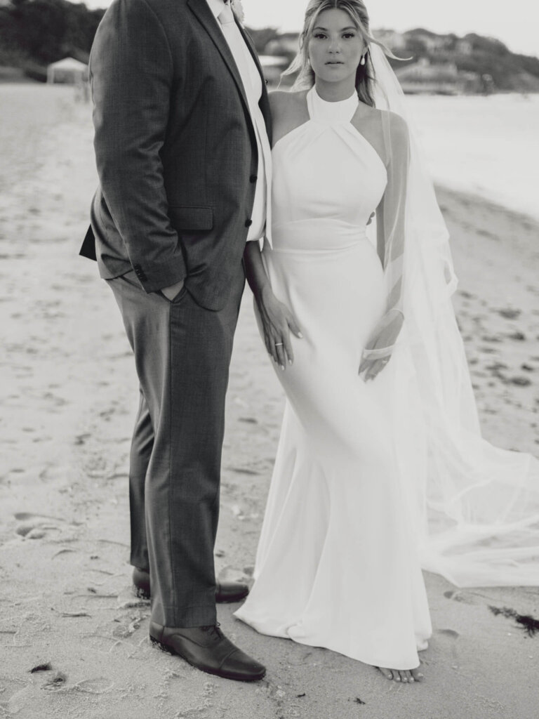 Bride and groom portrait on the shoreline at Chatham Bars Inn on Cape Cod