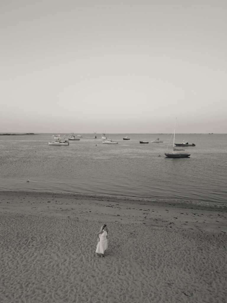 Bride and groom walking along the beach at Chatham Bars Inn