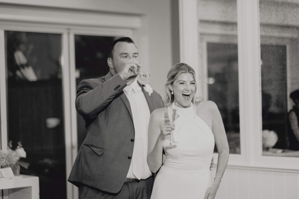 Bride smiling during a reception speech at Chatham Bars Inn