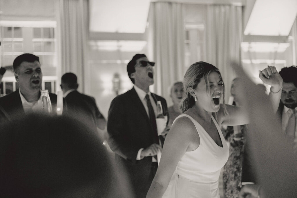 Bride and groom under a sparkler exit outside Chatham Bars Inn in Chatham, Massachusetts