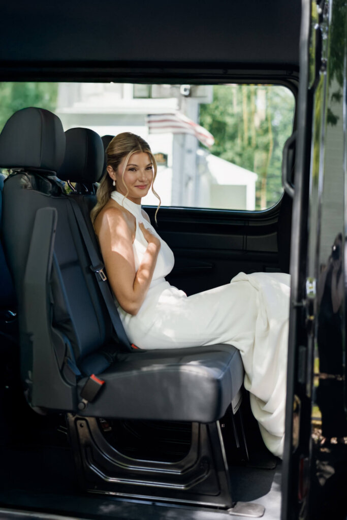 Bride sitting in the shuttle on the way to her Chatham Bars Inn wedding reception
