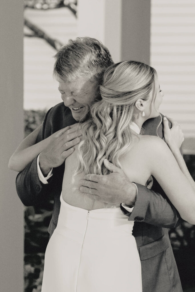 Bride hugging a family member before the church ceremony in Chatham, Massachusetts