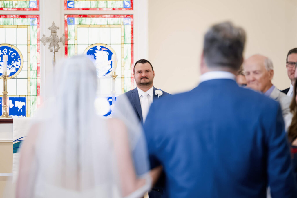 Bride walking down the aisle at St. Christopher’s Episcopal Church in Chatham, Massachusetts