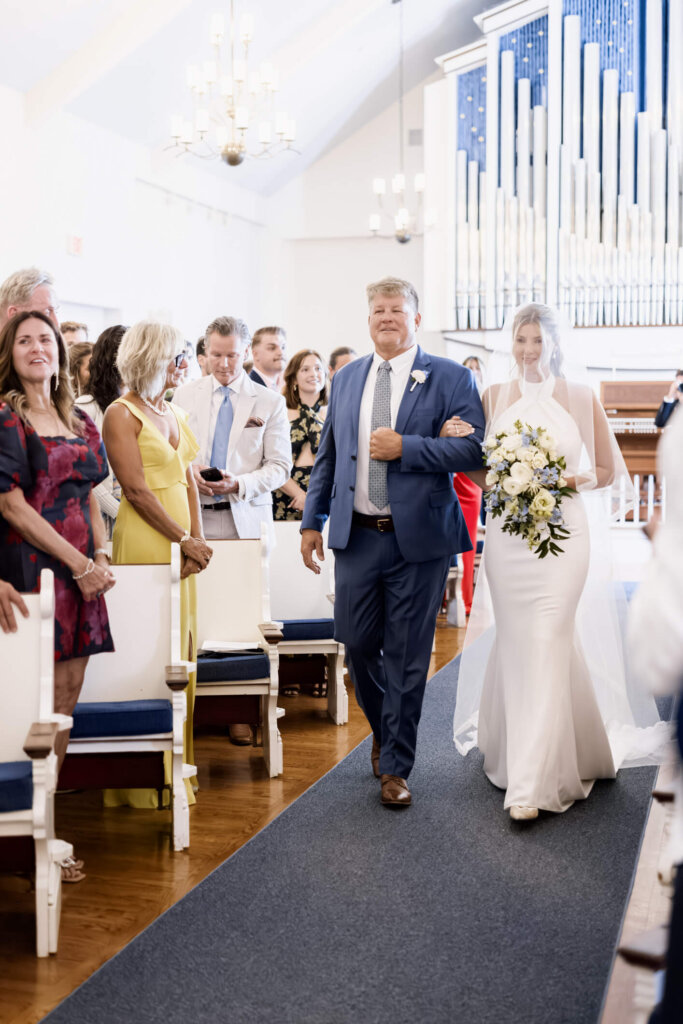 Bride and groom meeting at the altar during their Chatham church ceremony