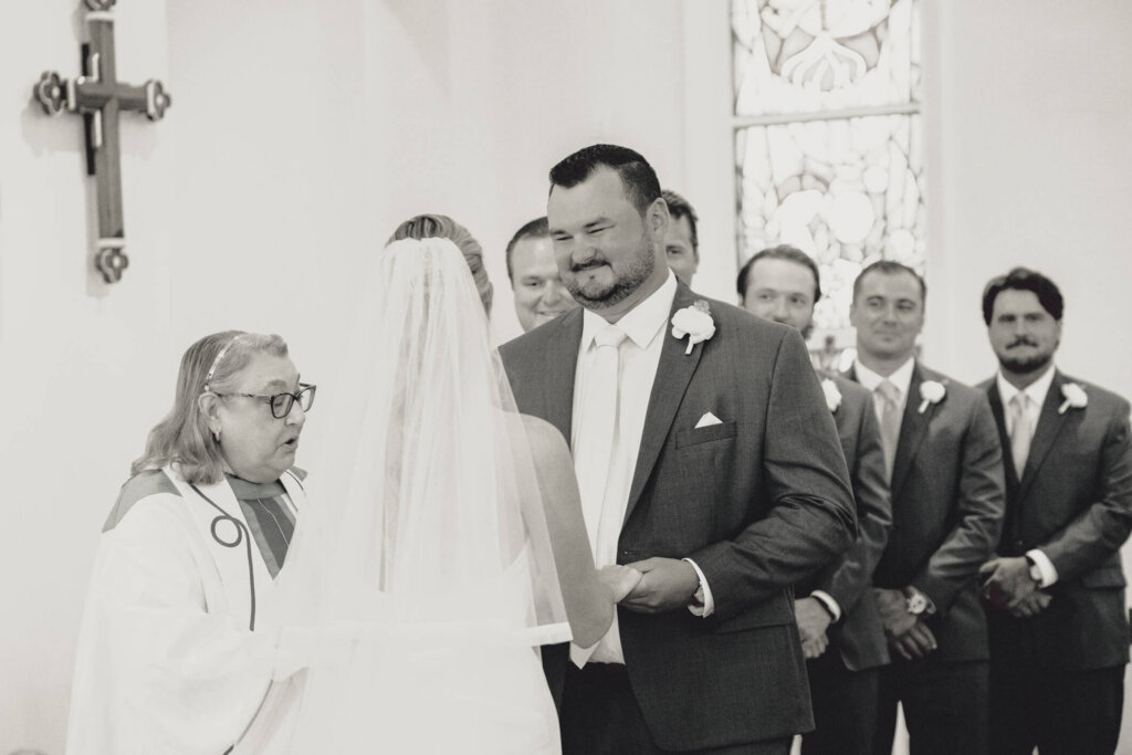 Bride and groom at the altar during their St. Christopher’s Episcopal Church ceremony