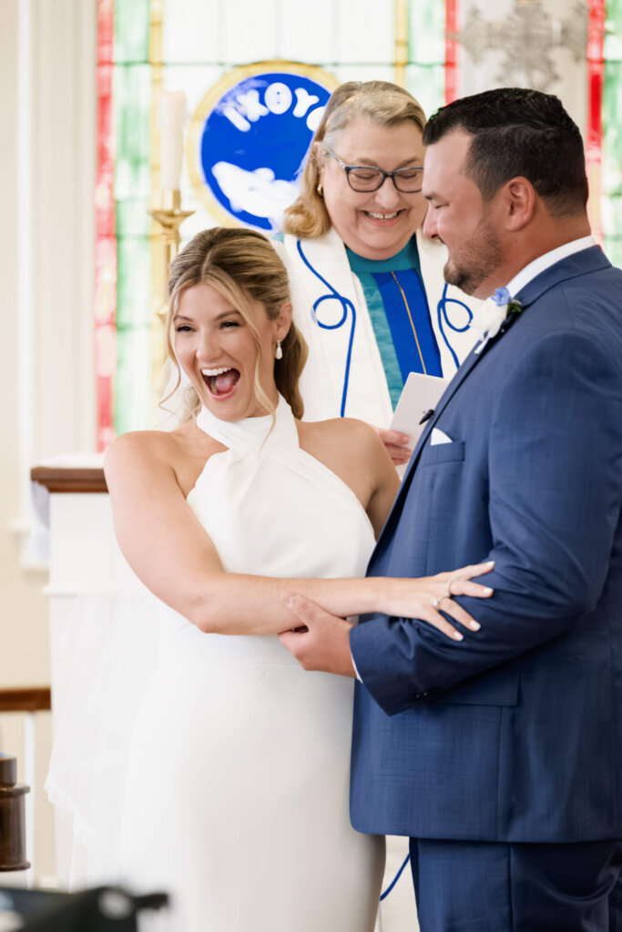 Bride and groom exchanging vows at St. Christopher’s Episcopal Church in Chatham