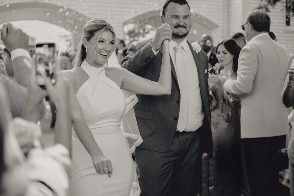 Guests tossing petals outside the church after the Chatham wedding ceremony