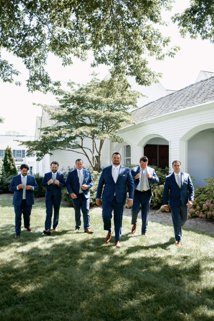 Bridesmaids and groomsmen outside the church after the ceremony in Chatham