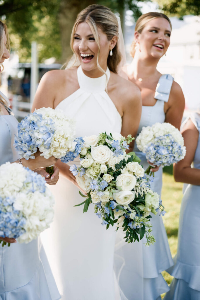 Bride and groom walking together outside Chatham Bars Inn on Cape Cod