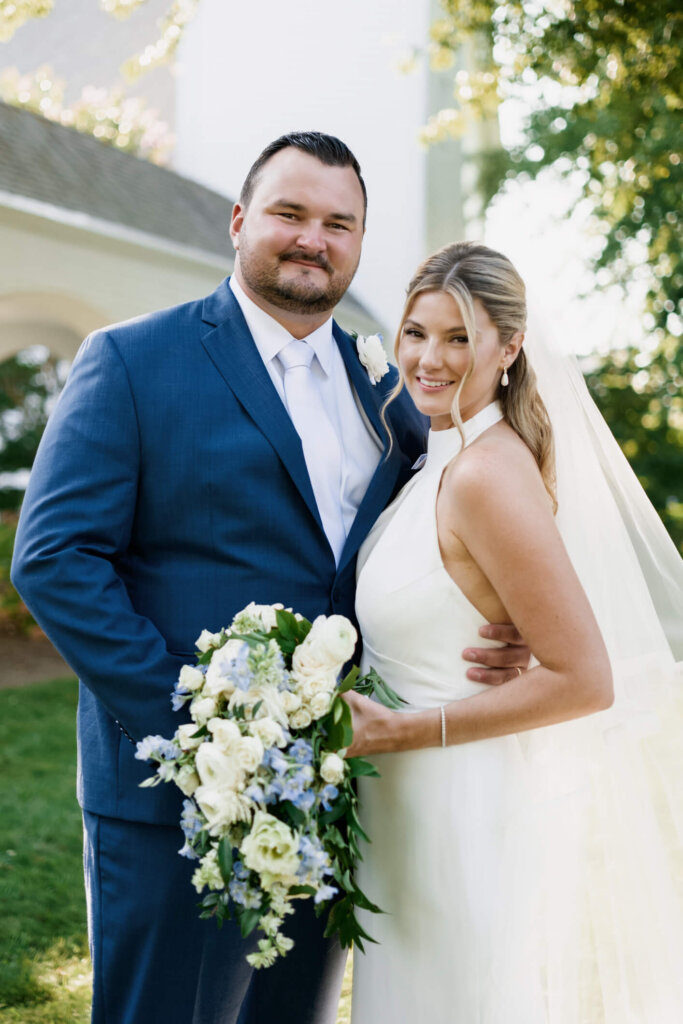 Bride and groom portrait with the Chatham Bars Inn grounds in the background