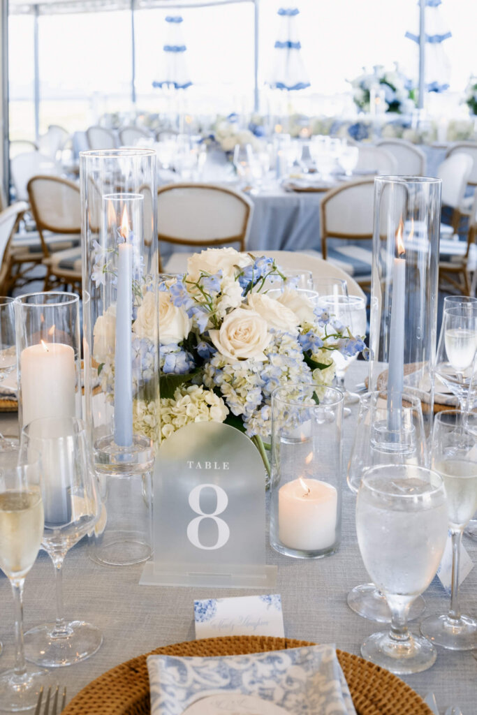 Table eight centerpiece and candles at a Chatham Bars Inn wedding reception