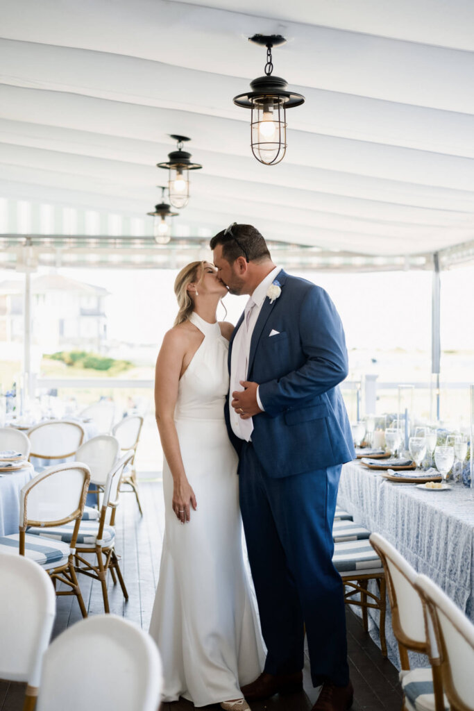 Bride and groom portrait inside the reception tent at Chatham Bars Inn on Cape Cod