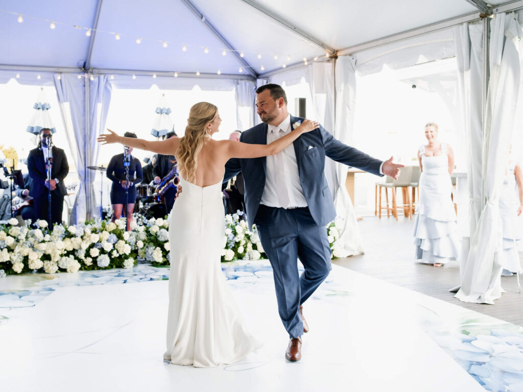 Bride and groom making their reception entrance at Chatham Bars Inn on Cape Cod