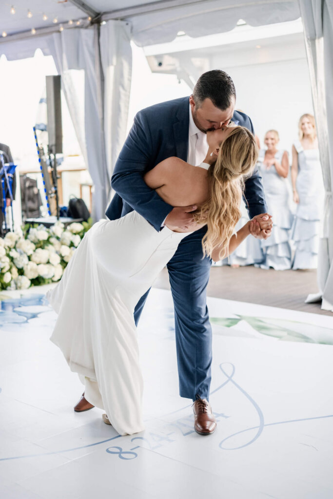 Bride and groom dipping during their first dance at Chatham Bars Inn reception