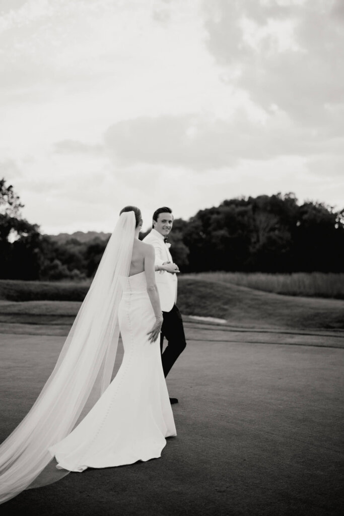 Bride and groom sunset portrait on the lawn at Bedford Golf and Tennis Club