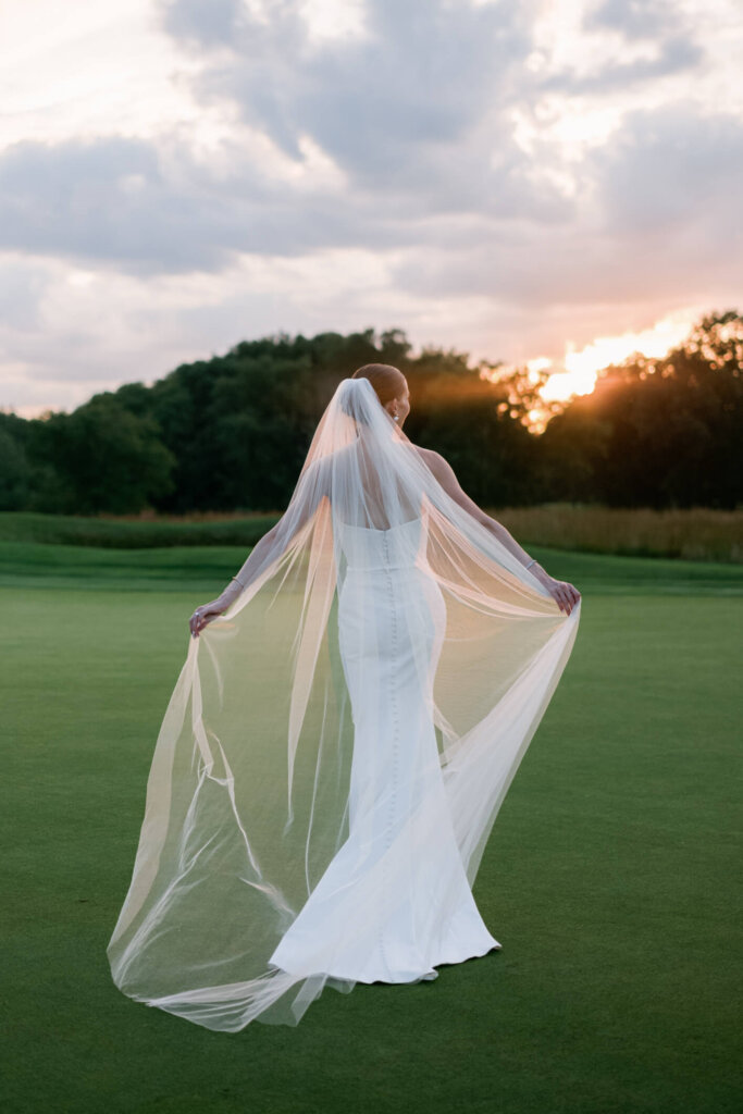 Bride and groom smiling together at sunset in Bedford, New York