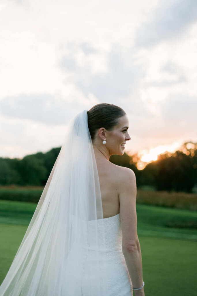 Bride and groom sunset portrait with soft veil at Bedford Golf and Tennis Club