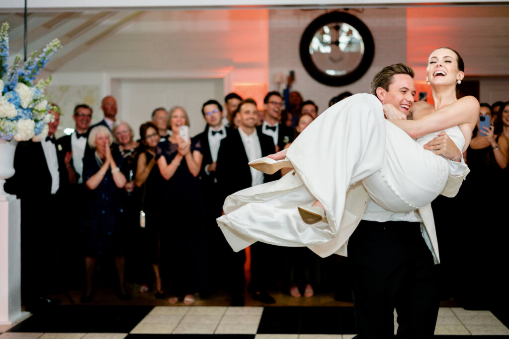 Bride and groom celebrating with friends at Bedford Golf and Tennis Club reception