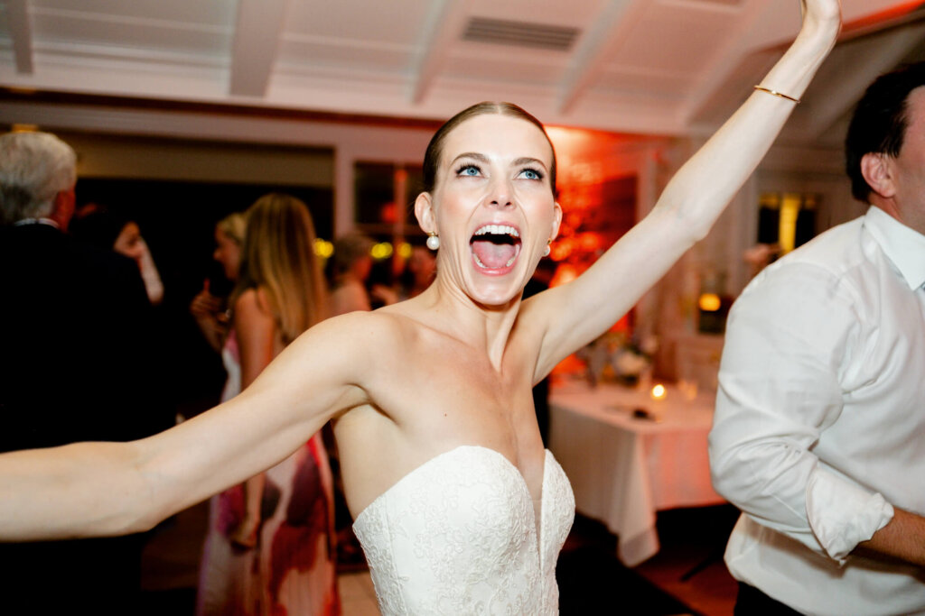 Groom dancing with guests during the Bedford Golf and Tennis Club wedding reception