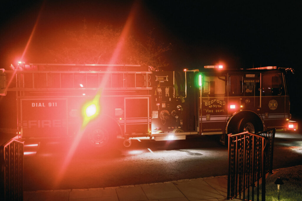 Groom with firefighters at the Bedford Golf and Tennis Club after party