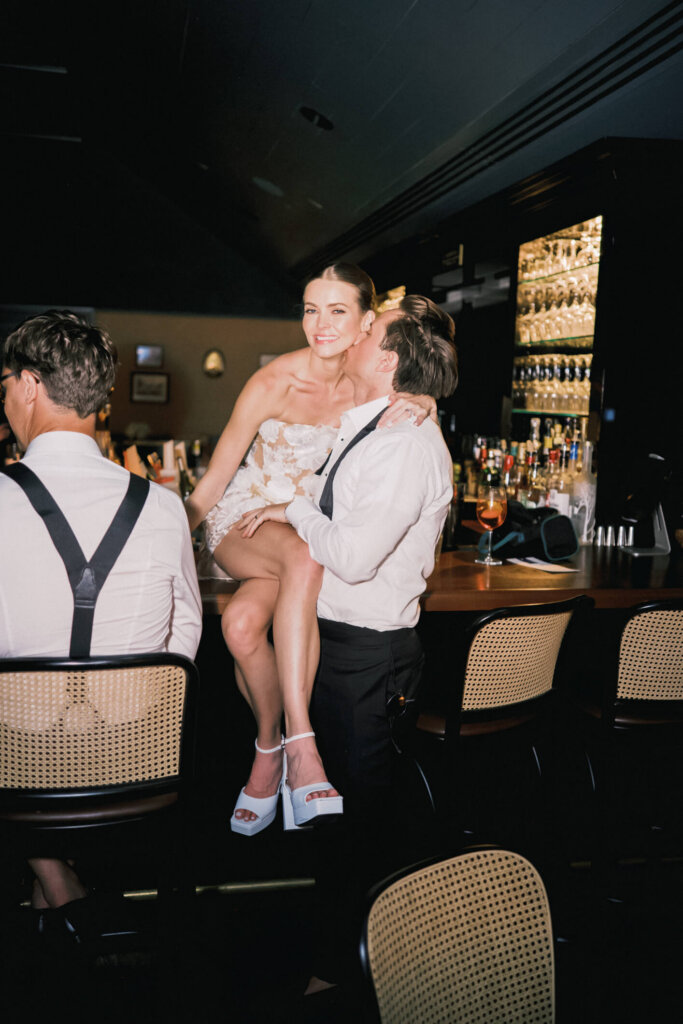 Bride showing off her reception shoes during the Bedford Golf and Tennis Club after party