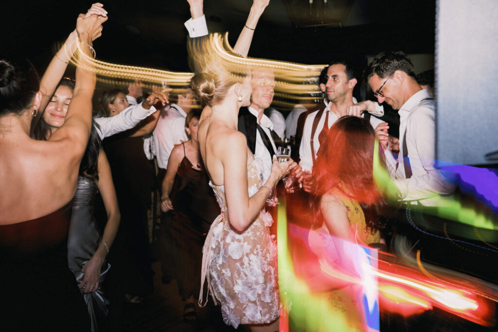 Bride and groom dancing with guests during the Bedford Golf and Tennis Club after party