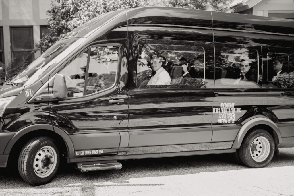 Bride arriving by limousine for her Bedford Golf and Tennis Club wedding