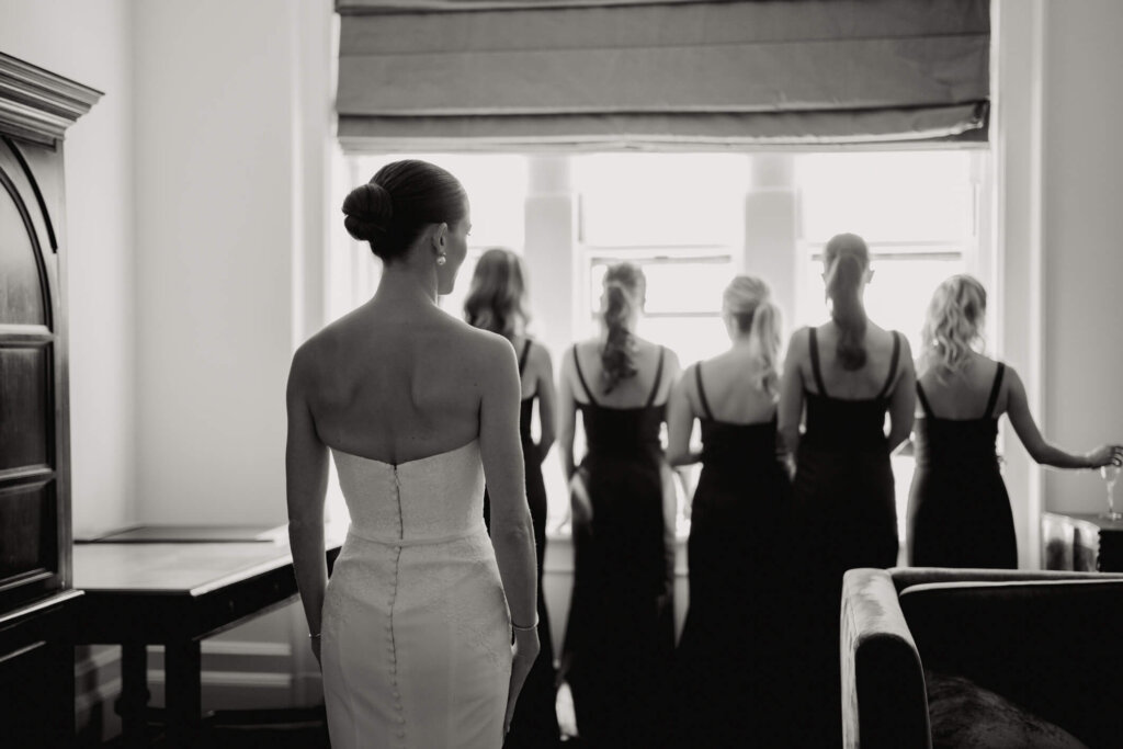 Bride stepping out of the car before the Bedford Golf and Tennis Club wedding outside NYC