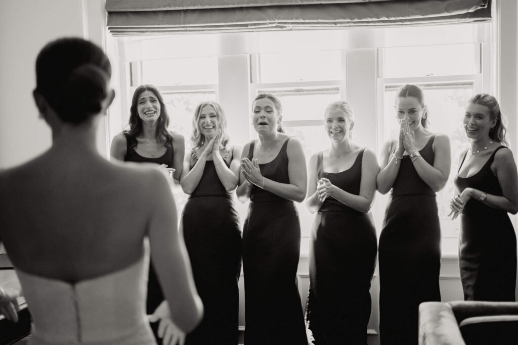 Bridesmaids reacting to the bride before the Bedford ceremony