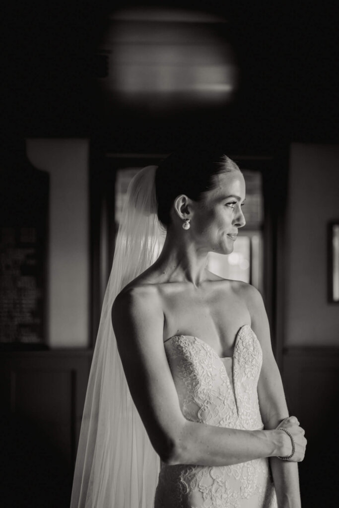 Bride walking outside before the Bedford Golf and Tennis Club wedding